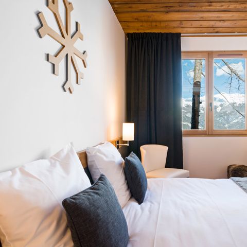 Slaapkamer 4 personen - Deluxe Familiekamer - Uitzicht op de Hellingen & Balkon