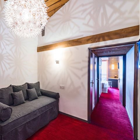 Hotelkamer 4 personen - Deluxe Familiekamer - Uitzicht op de Hellingen & Balkon