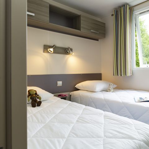 Stacaravan 7 personen - Confort 34m² - 3 kamers - Half overdekt terras - TV
