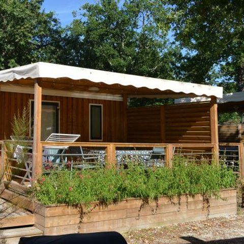Stacaravan 4 personen - PREMIUM Hout 28m² - 2 kamers + overdekt terras + TV + LV +BBQ + SOLARIUM